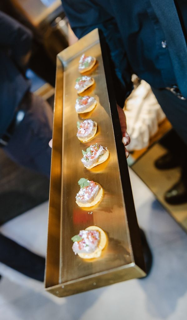 Luxury bites passed on a gold tray